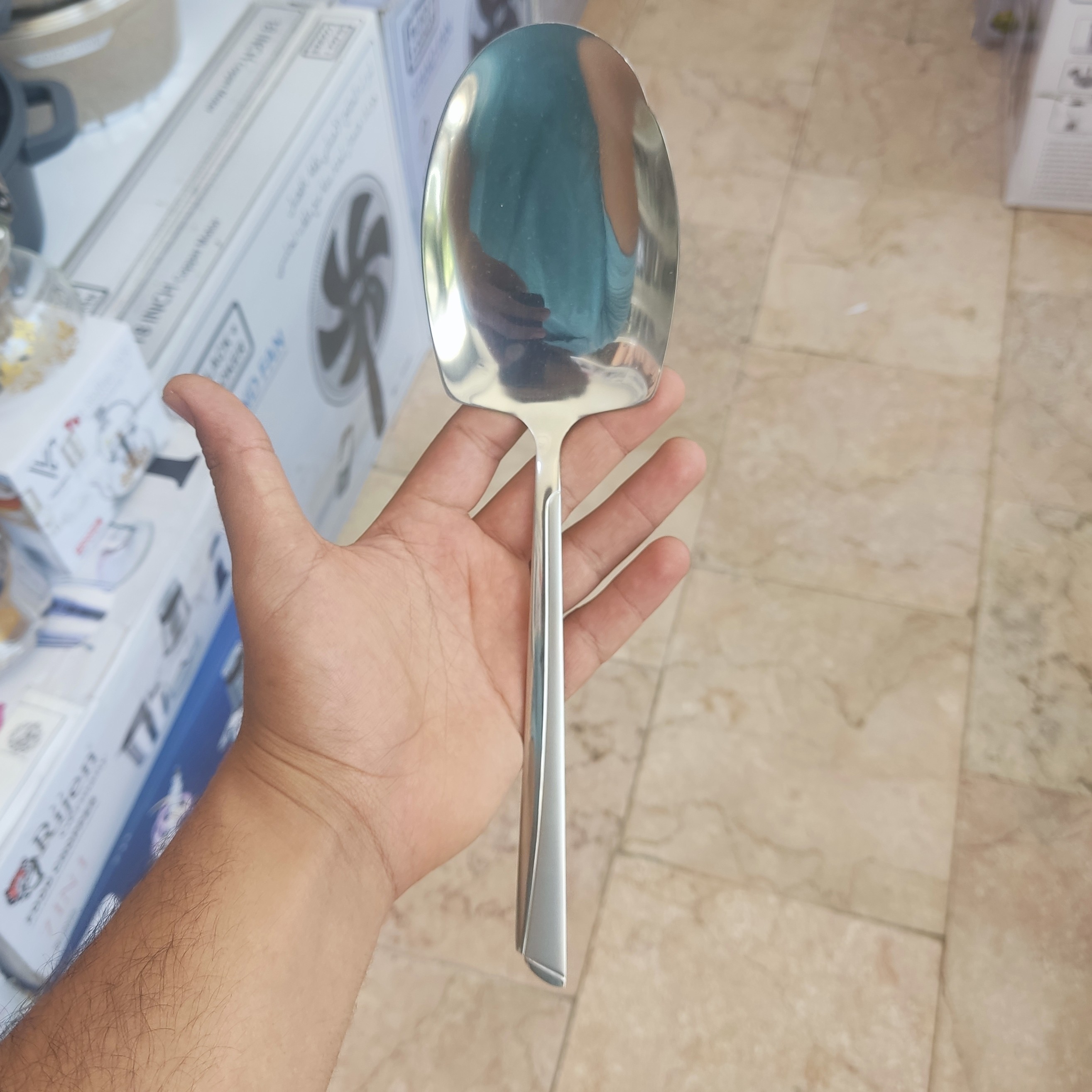کفگیر استیل یونیک طرح ناخنی